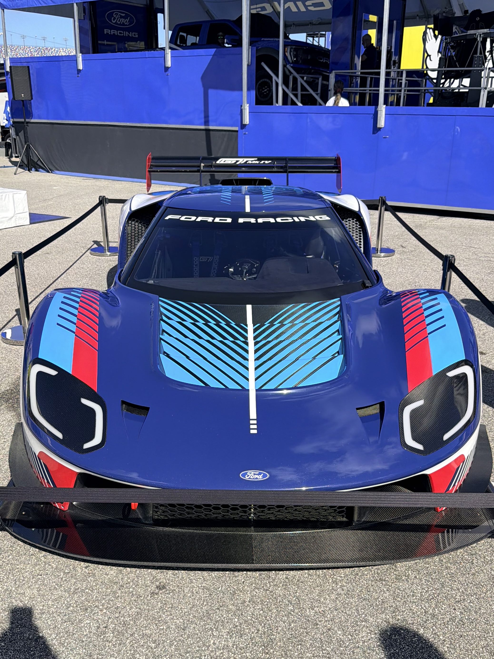 A Ford Racing-liveried Ford GT Mk IV on display in the fan activation area at Daytona International Speedway